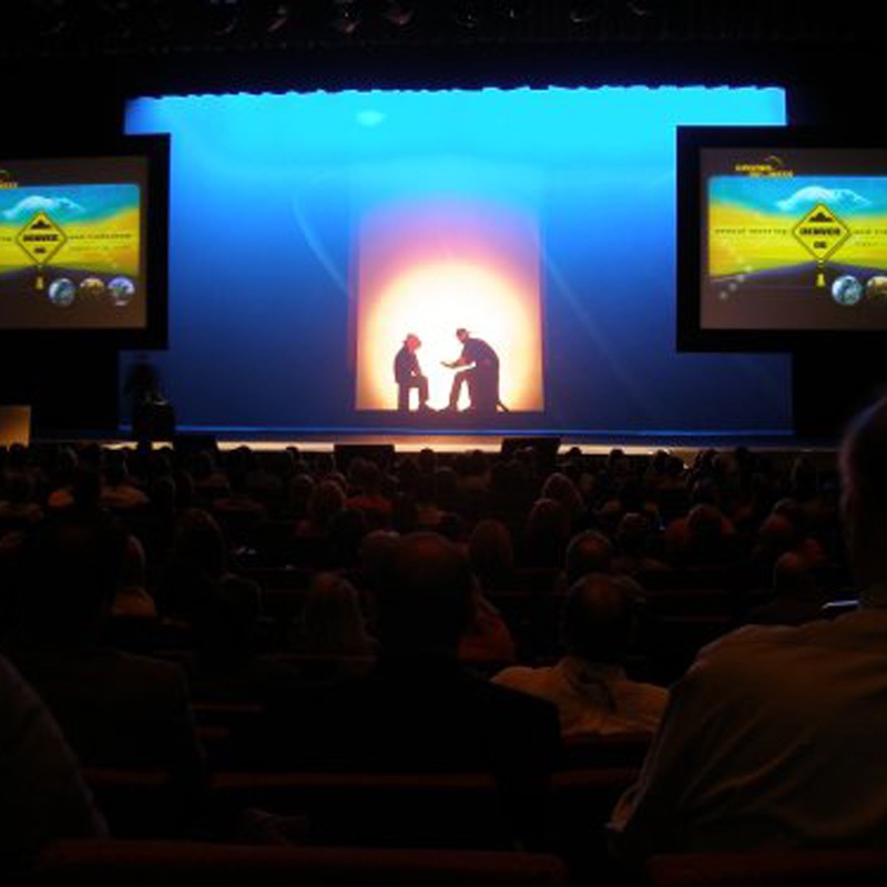 Stage production lighting and AV screen setup for events in Denver, CO