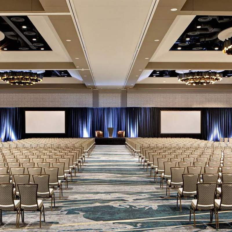 Corporate event showcasing staging and production with glowing columns in Denver, CO